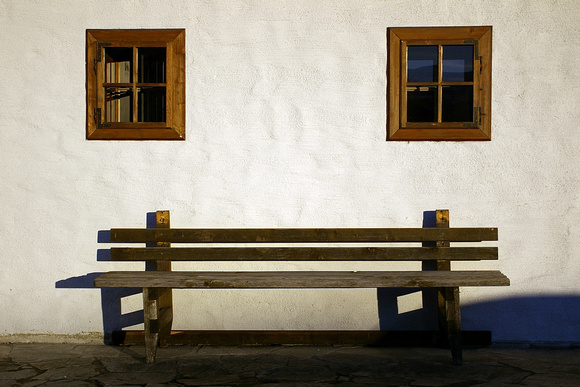 A bench in front of the oldest house in Werfenweng
